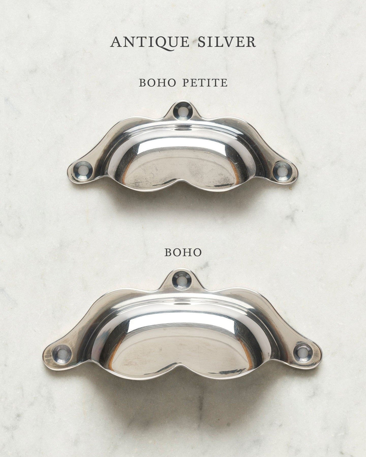 Two bohemian-style cup handles for a kitchen cupboard or drawer with a tarnished silver finish. There is a large and a small size. TEST