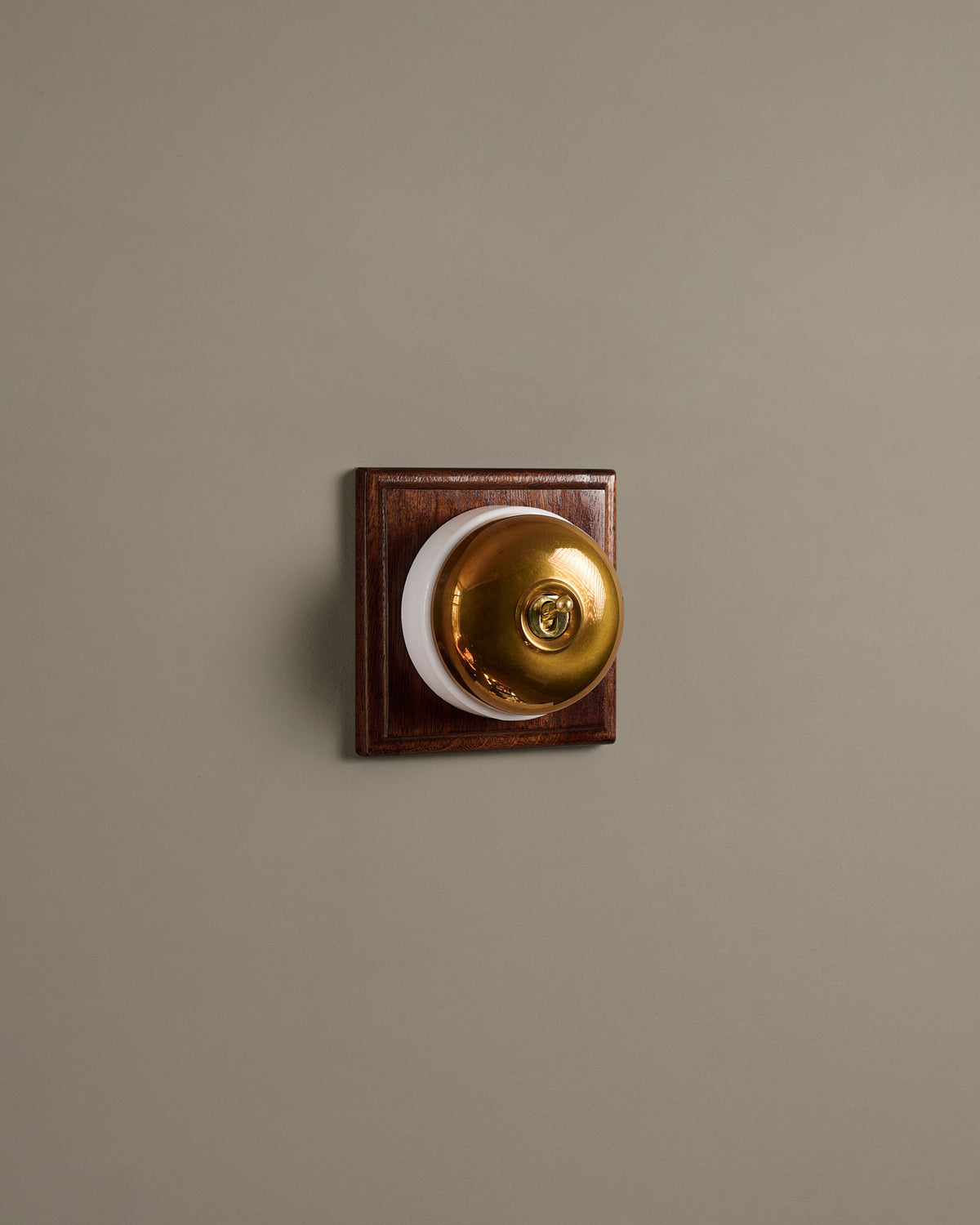 The Dolly Toggle Switch (1 Gang & Mahogany Finish Pattress) - Heirloom Brass with White Base. TEST