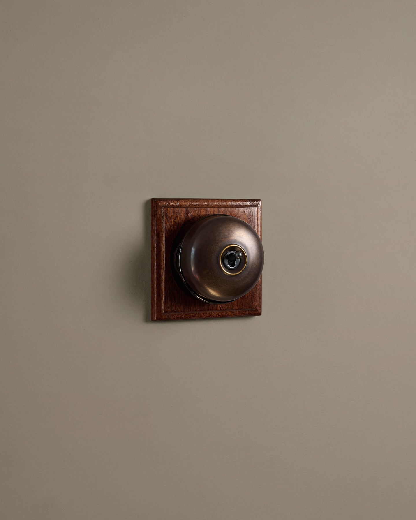 The Dolly Toggle Switch (1 Gang & Mahogany Finish Pattress) - Oxidised Brass with Black Base.