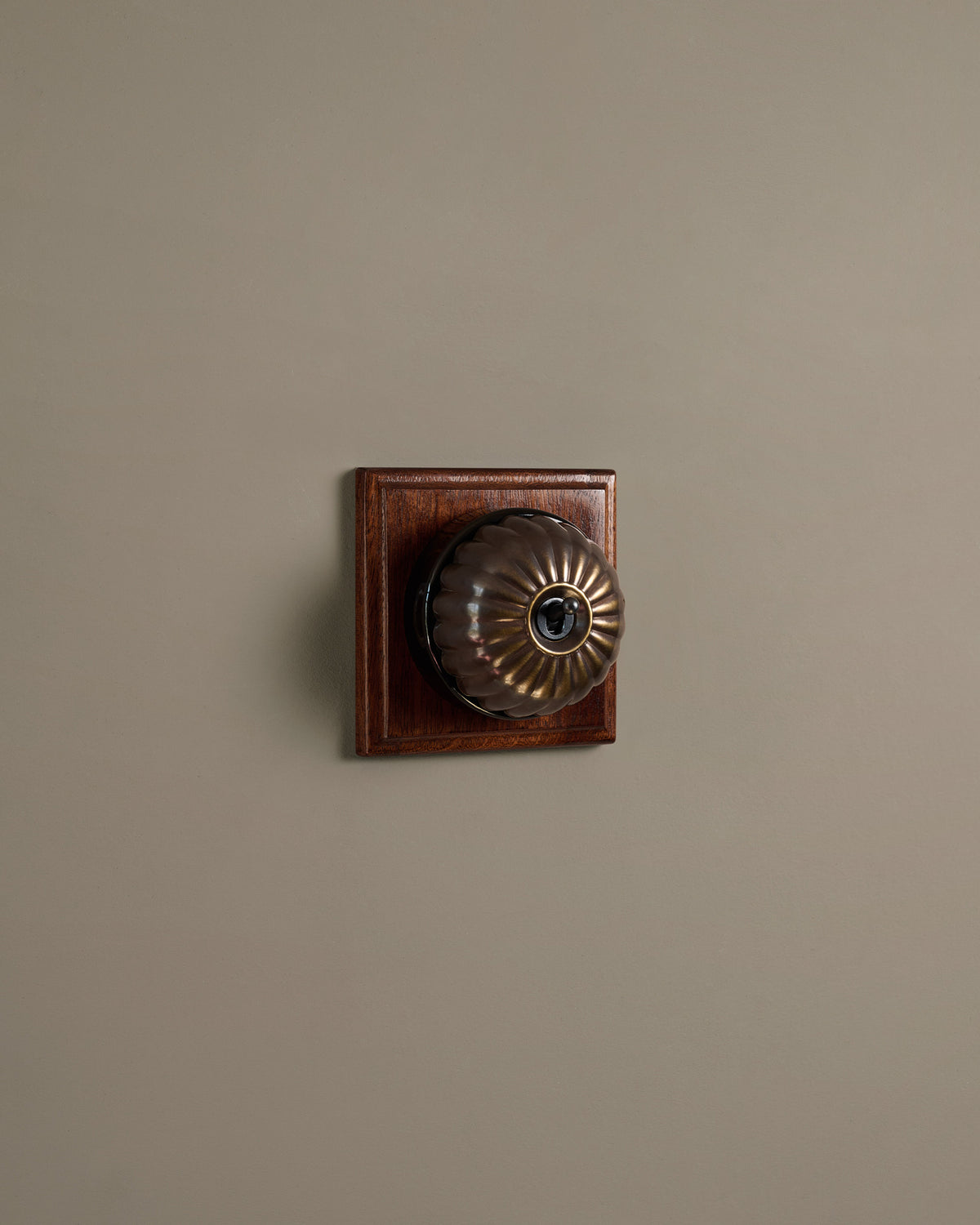 The Jelly Toggle Switch (1 Gang & Mahogany Finish Pattress) - Oxidised Brass with Black Base. TEST