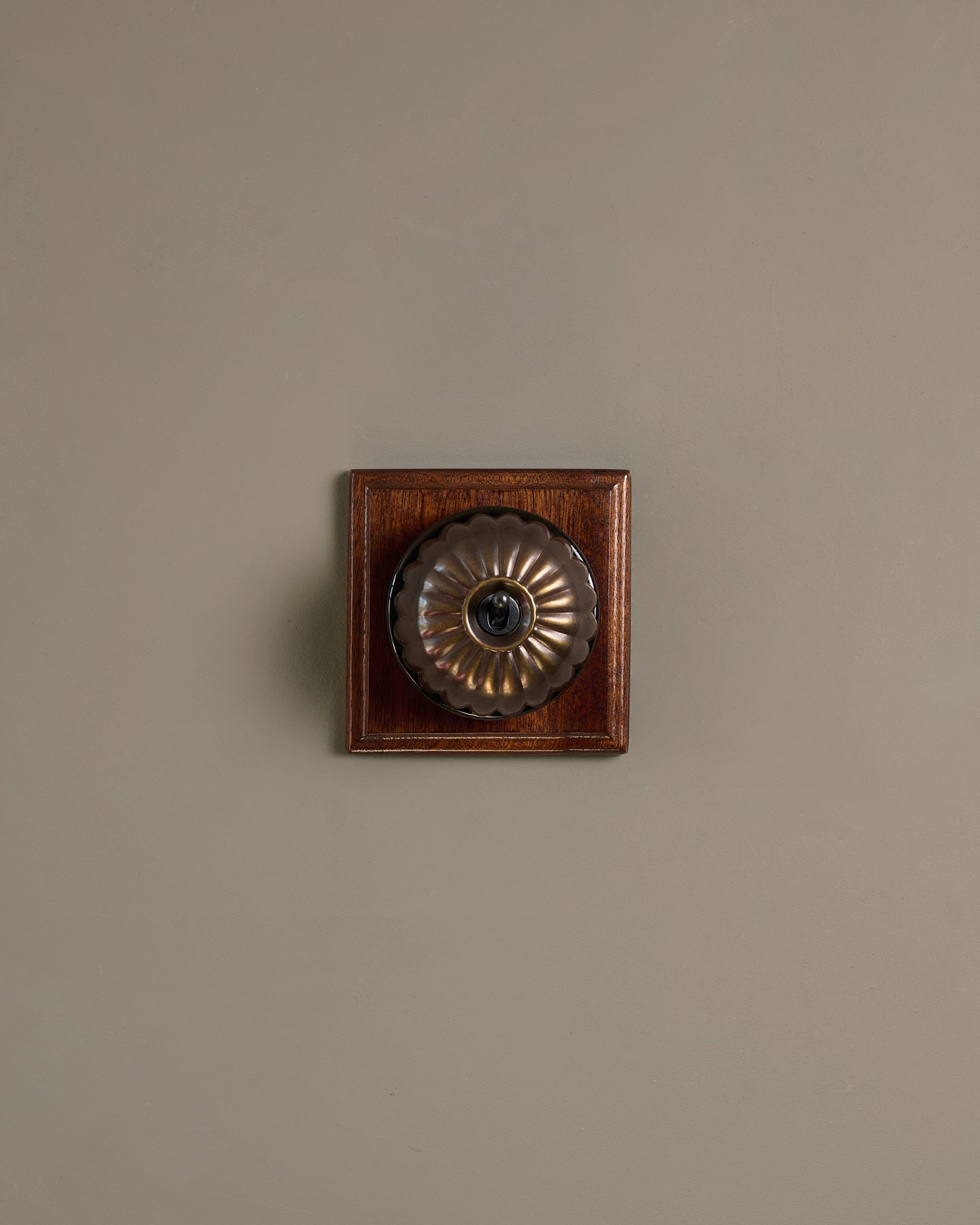 The Jelly Toggle Switch (1 Gang & Mahogany Finish Pattress) - Oxidised Brass with Black Base.
