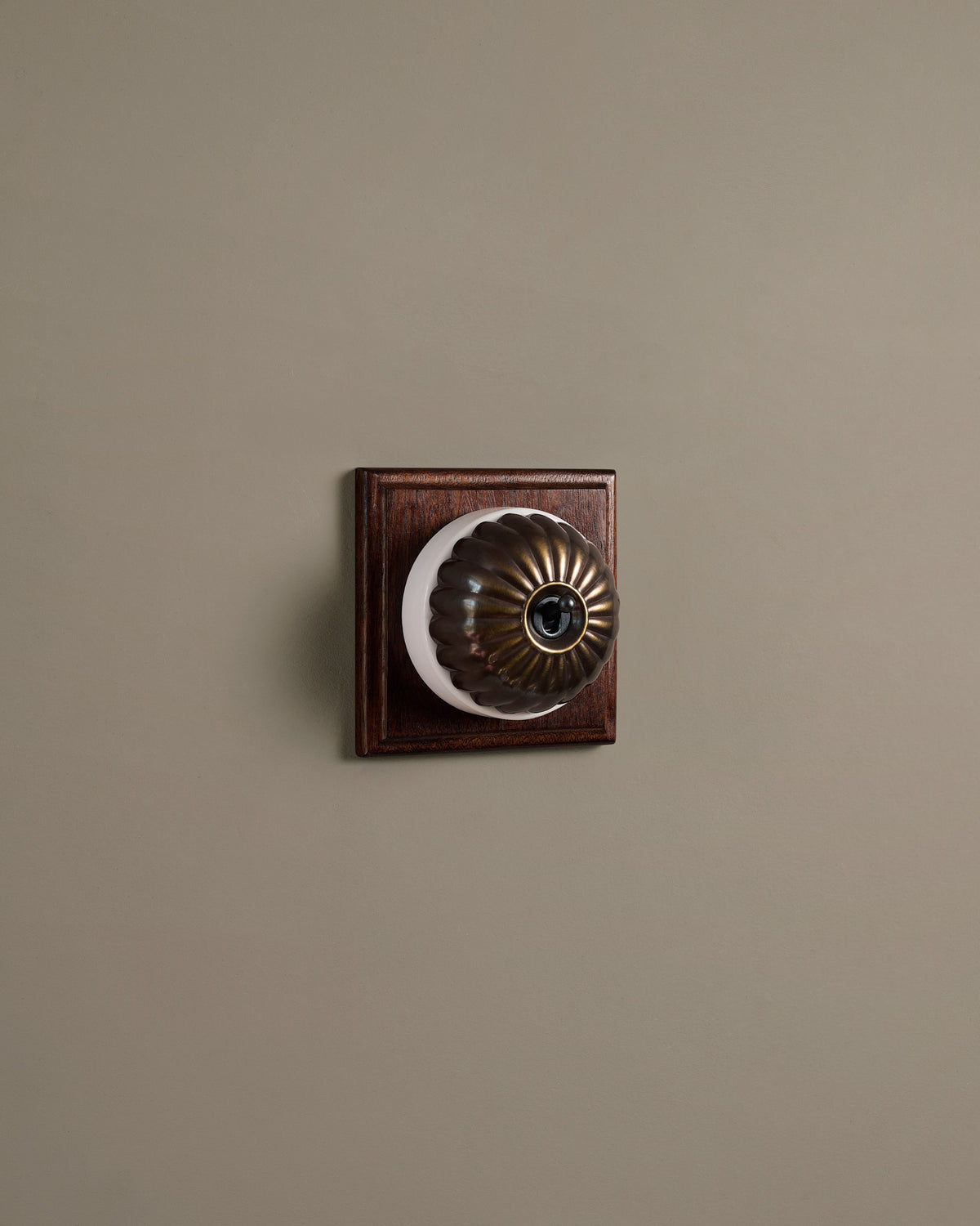 The Jelly Toggle Switch (1 Gang & Mahogany Finish Pattress) - Oxidised Brass with White Base. TEST