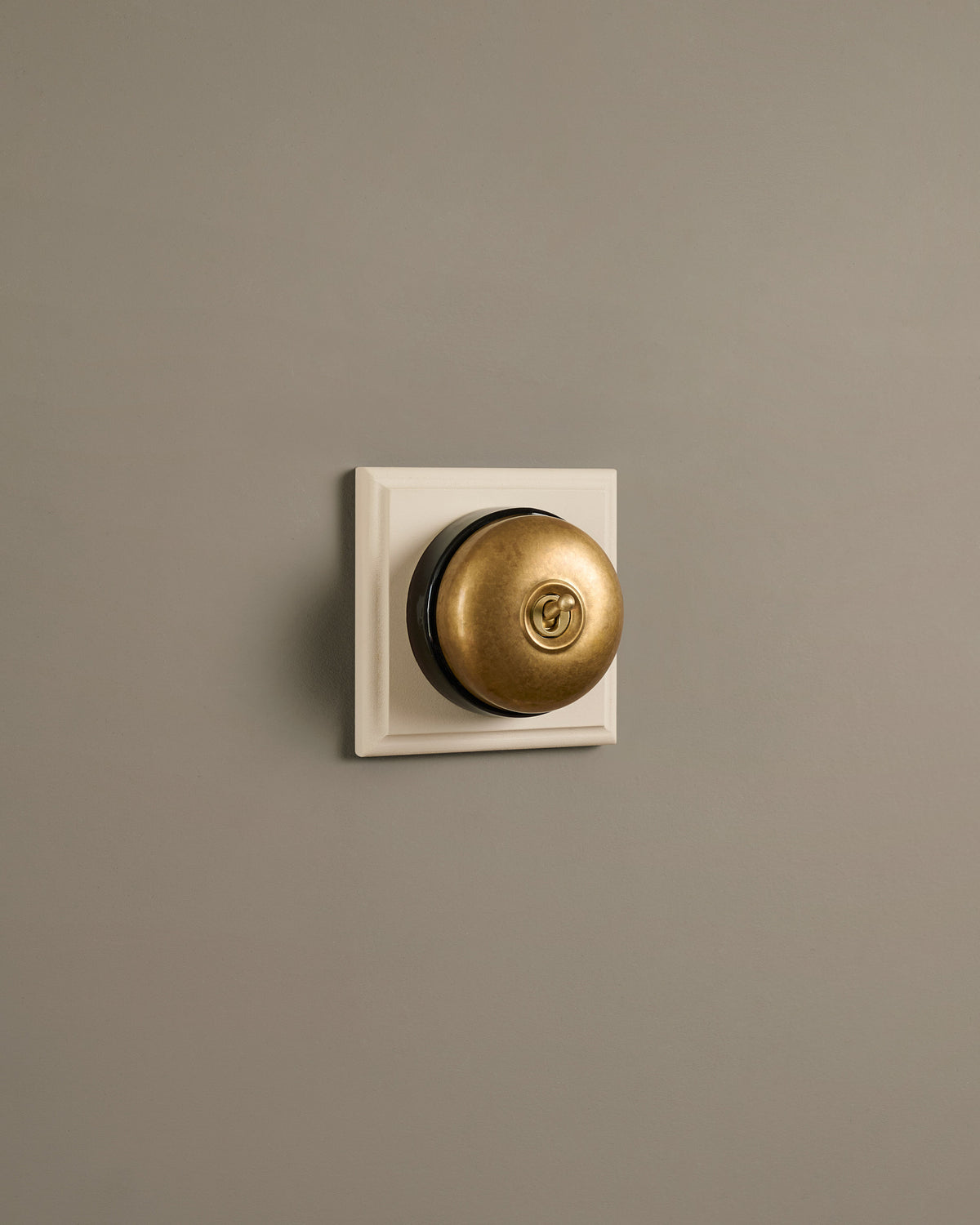 The Dolly Toggle Switch (1 Gang & Primed Maple Pattress) - Aged Brass with Black Base. TEST