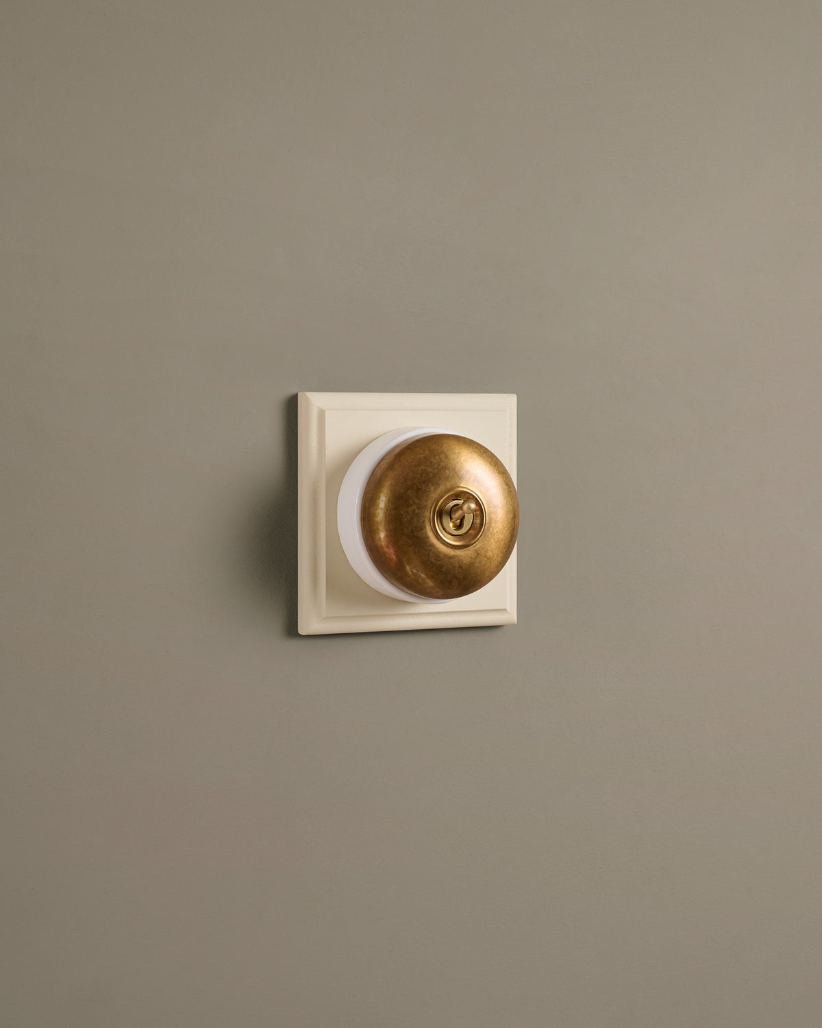 The Dolly Toggle Switch (1 Gang & Primed Maple Pattress) - Aged Brass with White Base. TEST