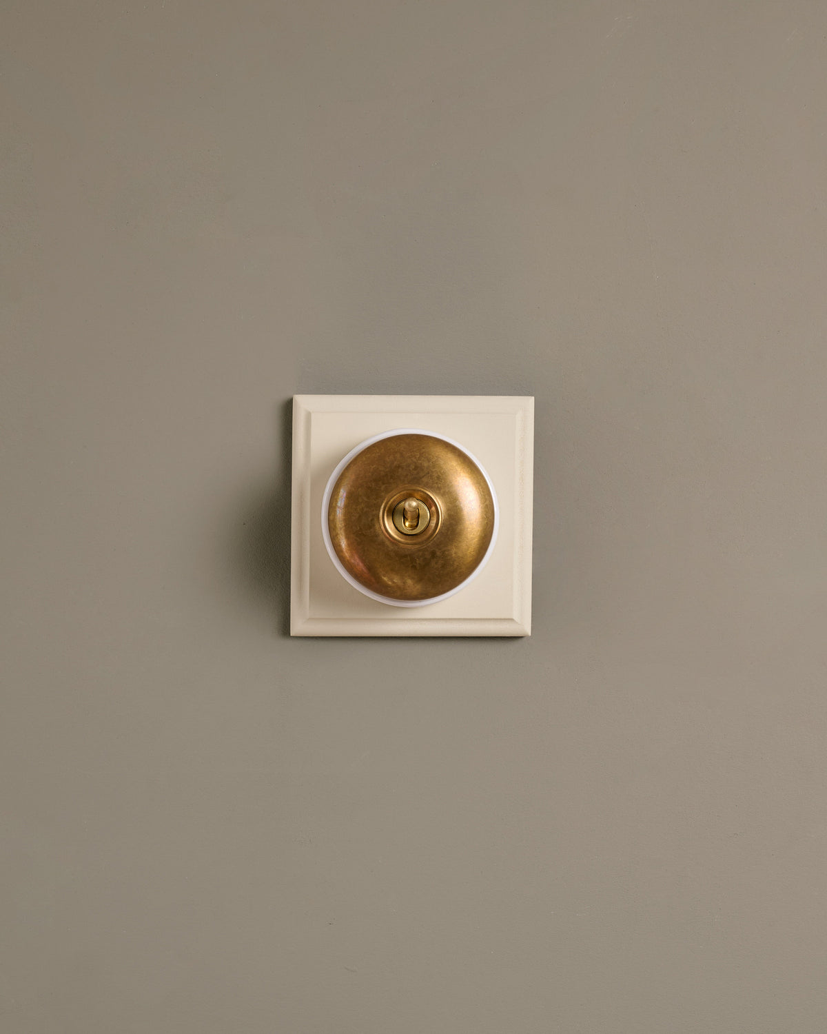 The Dolly Toggle Switch (1 Gang & Primed Maple Pattress) - Aged Brass with White Base. TEST