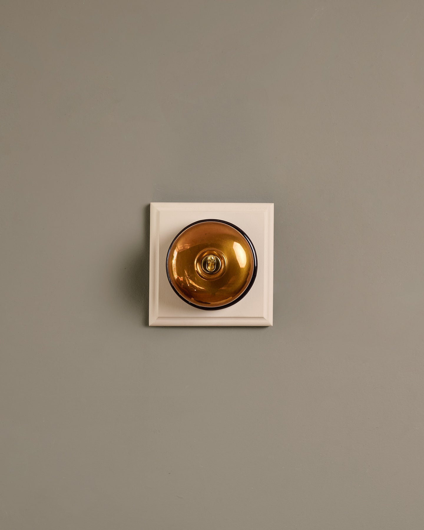 The Dolly Toggle Switch (1 Gang & Primed Maple Pattress) - Heirloom Brass with Black Base.