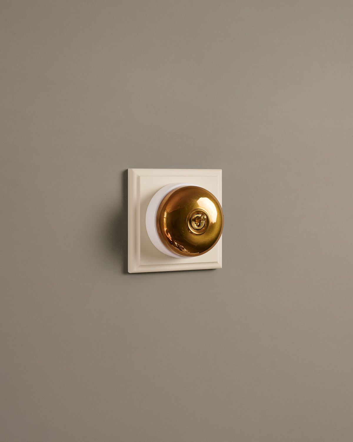 The Dolly Toggle Switch (1 Gang & Primed Maple Pattress) - Heirloom Brass with White Base. TEST