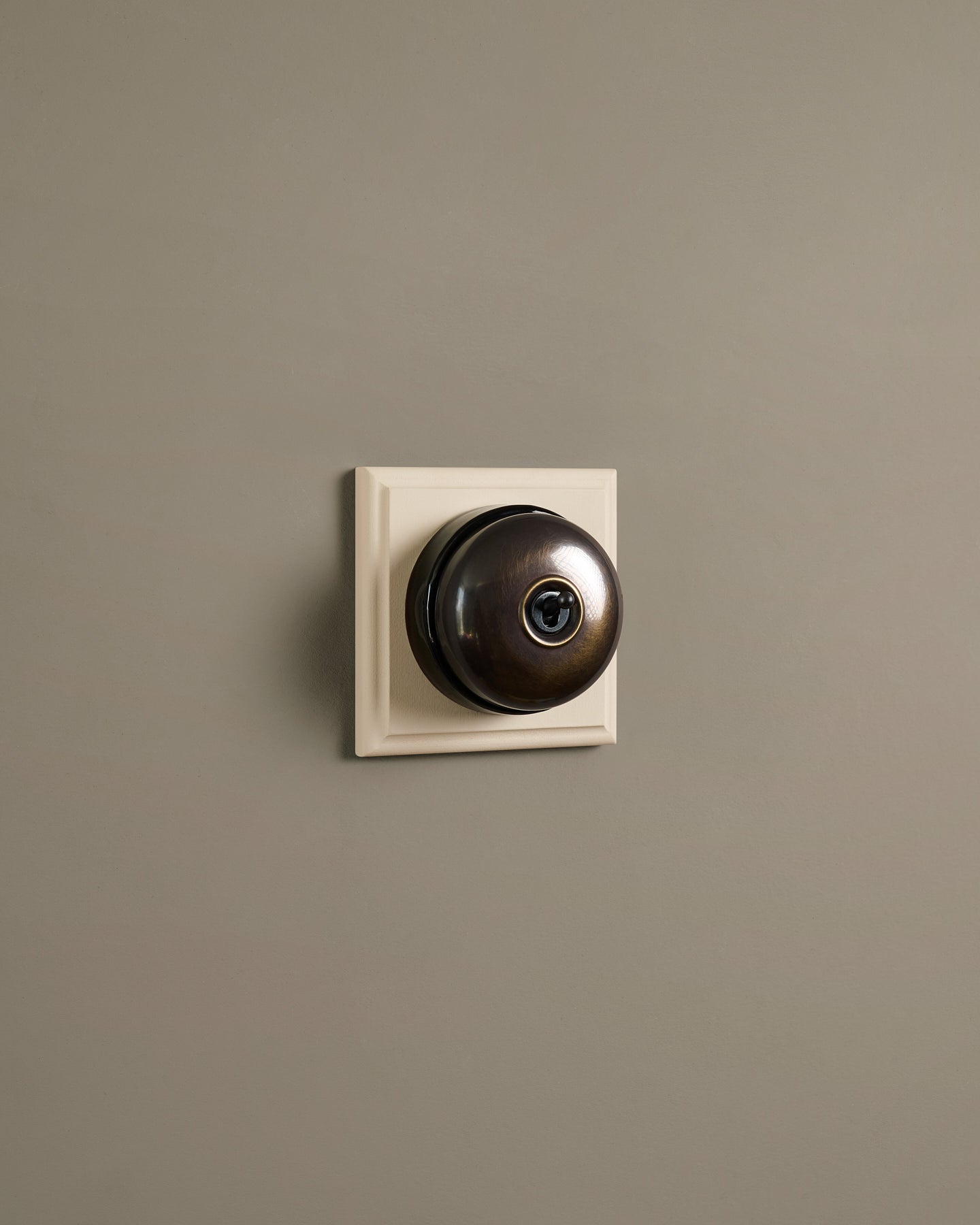 The Dolly Toggle Switch (1 Gang & Primed Maple Pattress) - Oxidised Brass with Black Base.