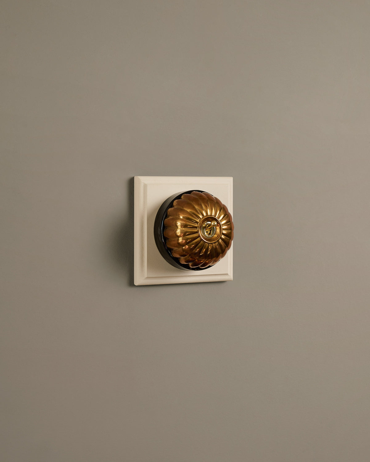 The Jelly Toggle Switch (1 Gang & Primed Maple Pattress) - Heirloom Brass with Black Base. TEST