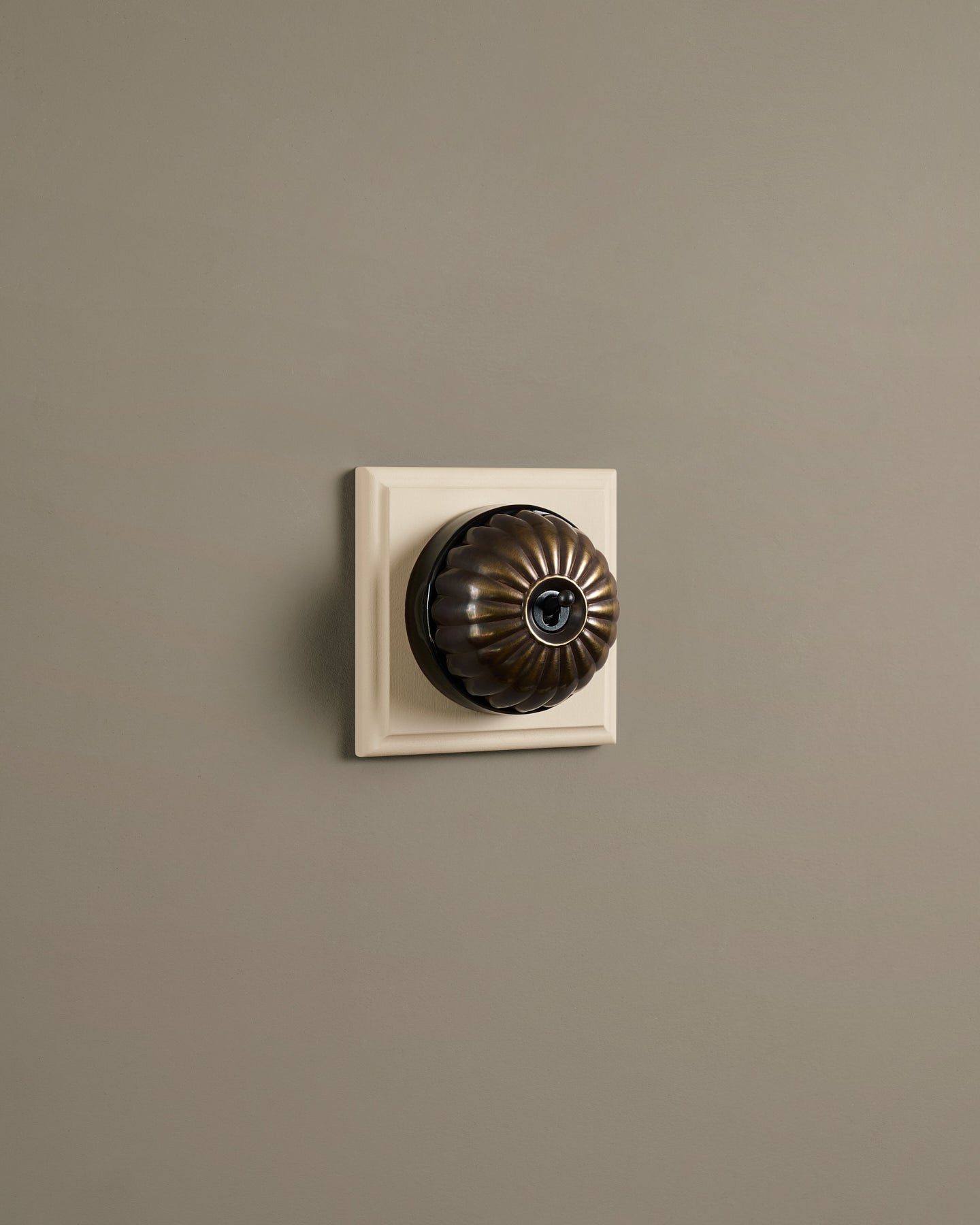 The Jelly Toggle Switch (1 Gang & Primed Maple Pattress) - Oxidised Brass with Black Base.