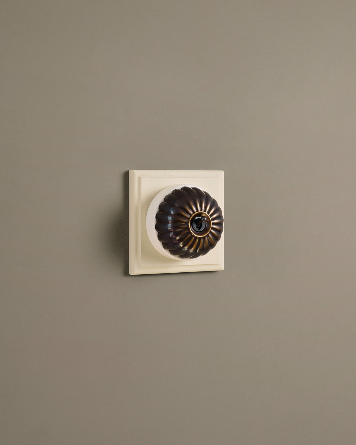 The Jelly Toggle Switch (1 Gang & Primed Maple Pattress) - Oxidised Brass with White Base. TEST