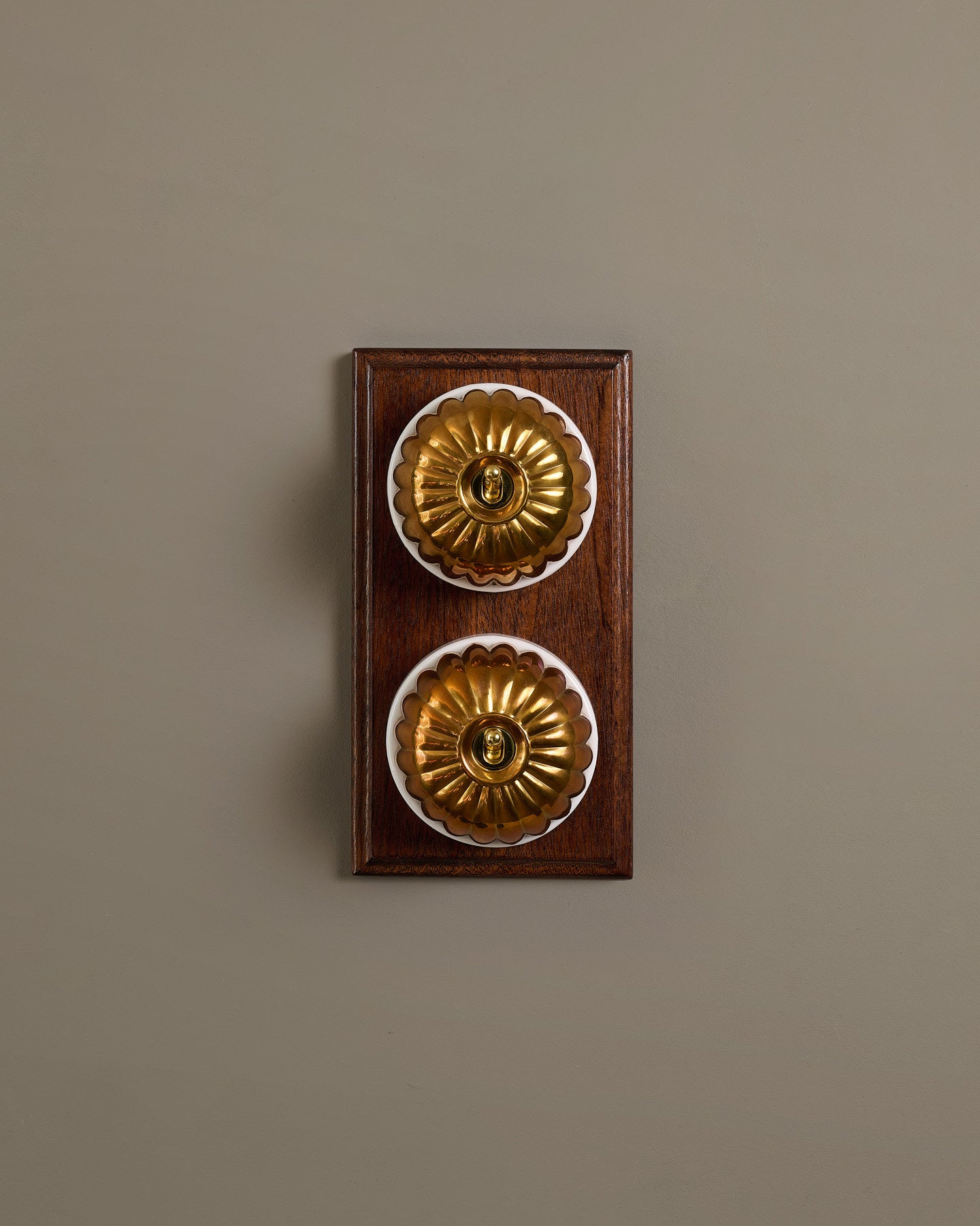 The Jelly Toggle Switch (2 Gang & Mahogany Finish Pattress) - Heirloom Brass with White Base.