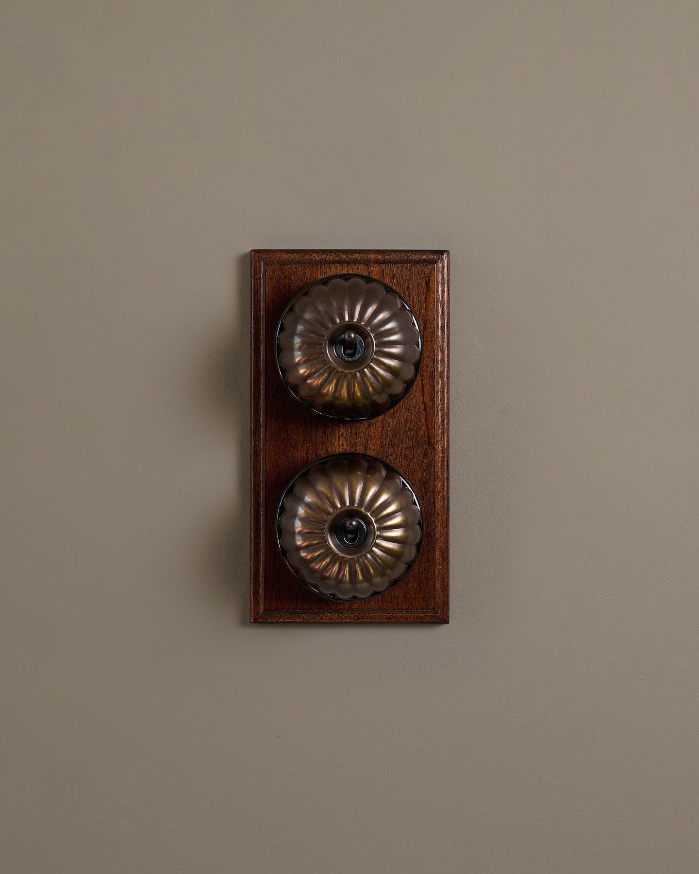 The Jelly Toggle Switch (2 Gang & Mahogany Finish Pattress) - Oxidised Brass with Black Base.