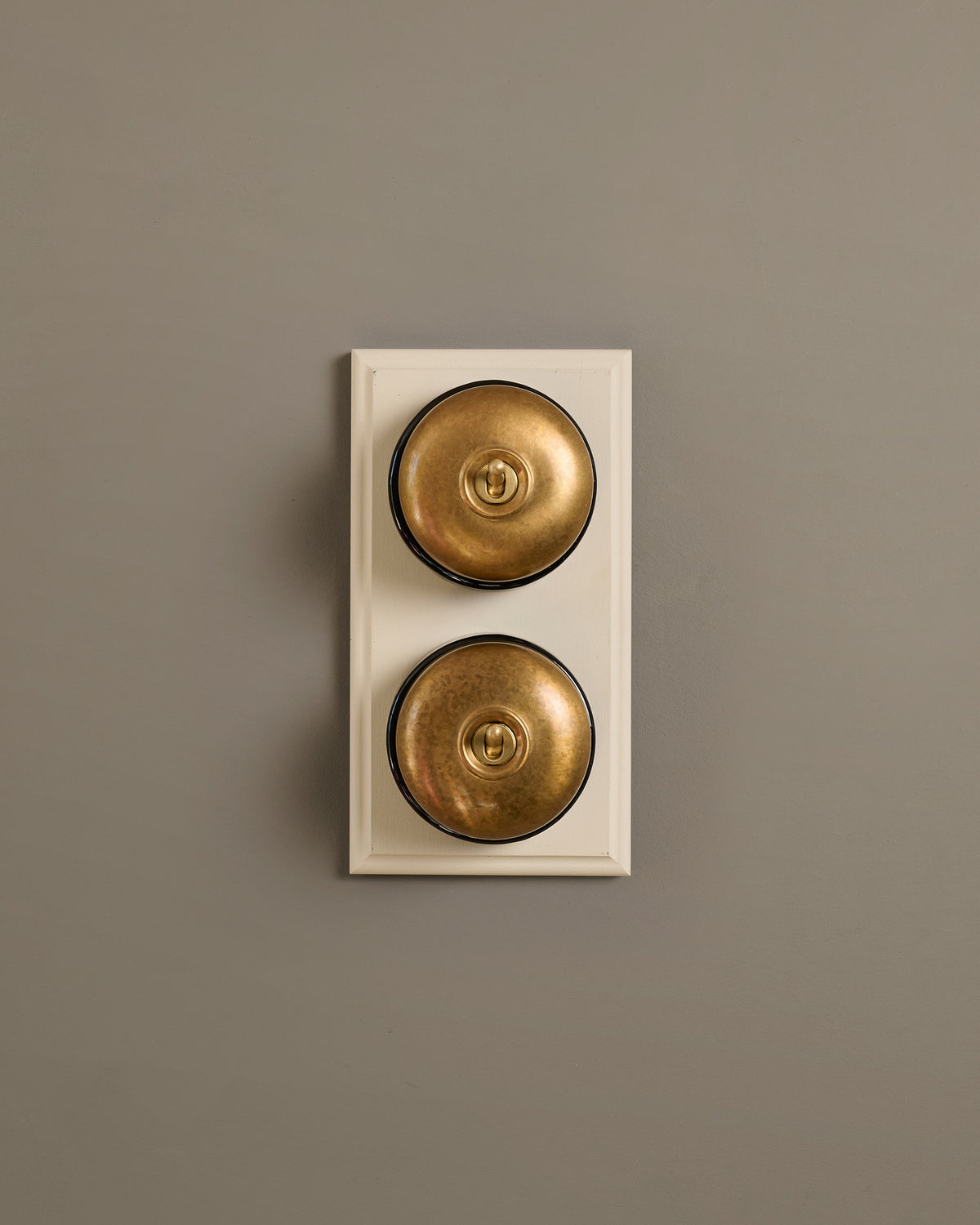 The Dolly Toggle Switch (2 Gang & Primed Maple Pattress) - Aged Brass with Black Base. TEST