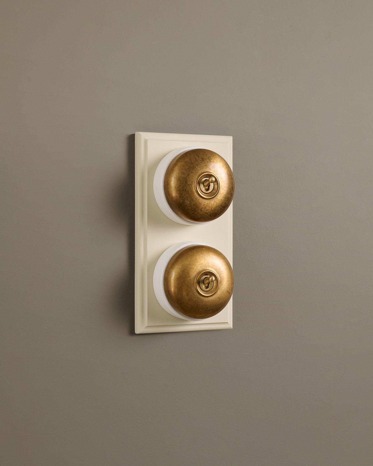 The Dolly Toggle Switch (2 Gang & Primed Maple Pattress) - Aged Brass with White Base.
