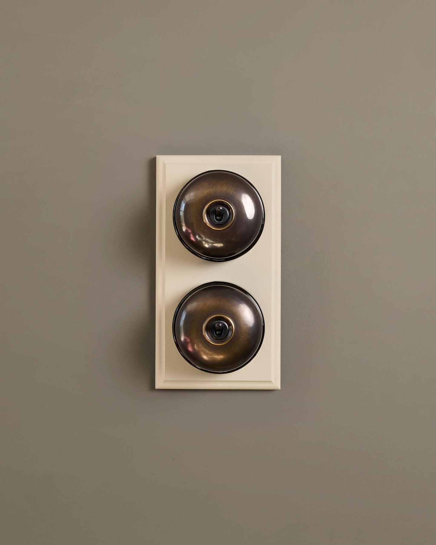 The Dolly Toggle Switch (2 Gang & Primed Maple Pattress) - Oxidised Brass with Black Base.