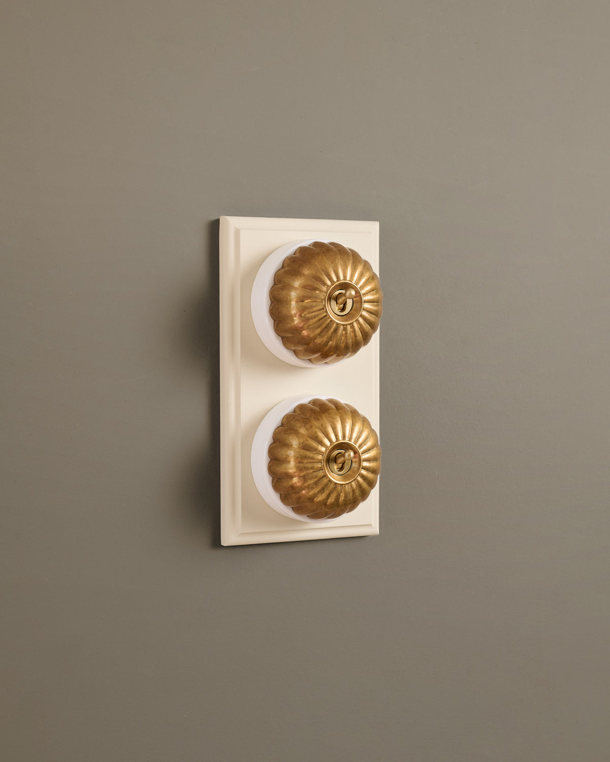 The Jelly Toggle Switch (2 Gang & Primed Maple Pattress) - Aged Brass with White Base. TEST