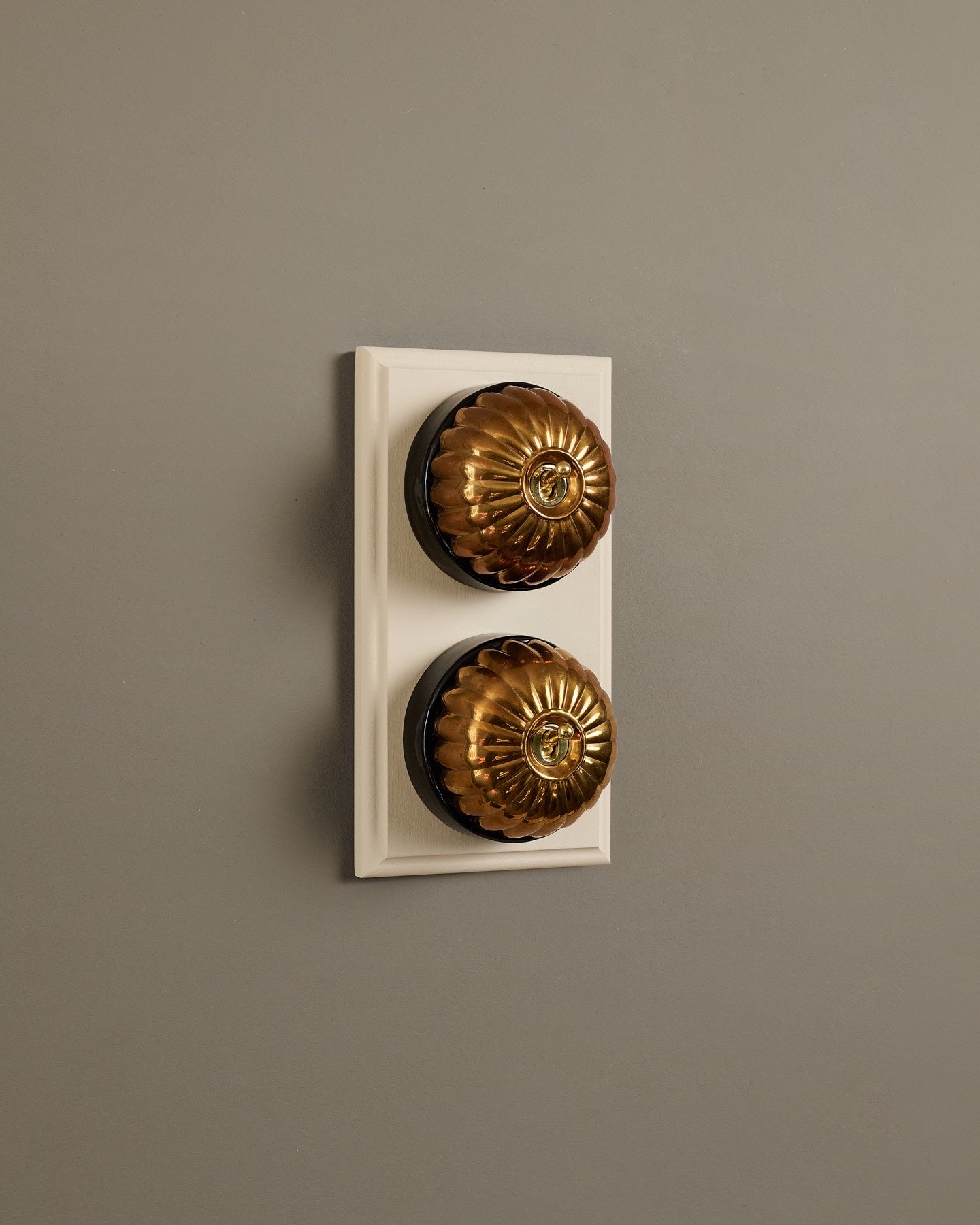 The Jelly Toggle Switch (2 Gang & Primed Maple Pattress) - Heirloom Brass with Black Base.