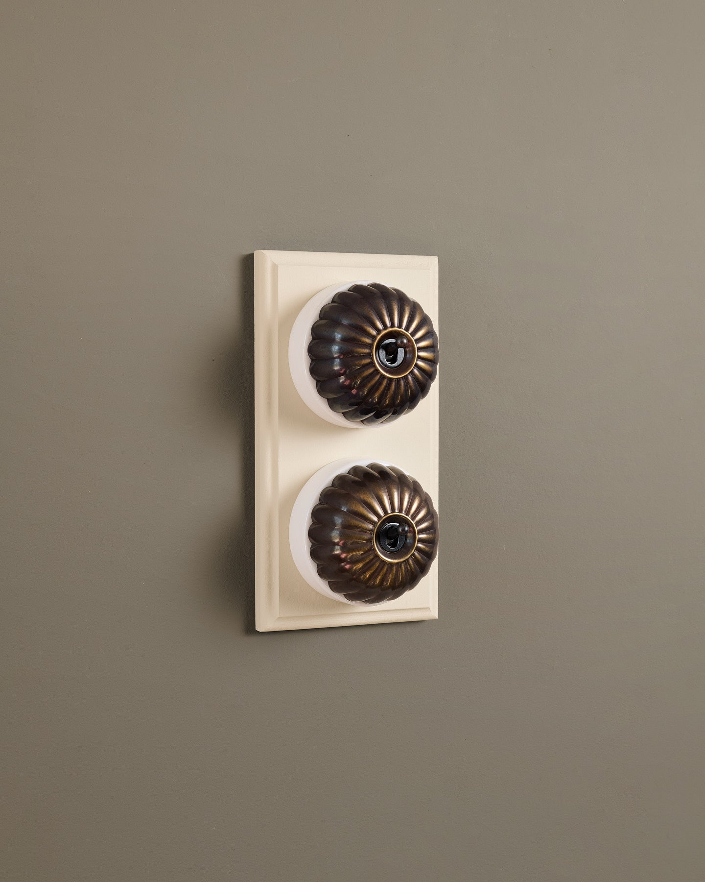The Jelly Toggle Switch (2 Gang & Primed Maple Pattress) - Oxidised Brass with White Base.