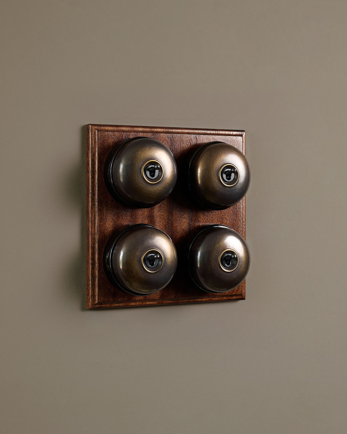 The Dolly Toggle Switch (4 Gang Bank & Mahogany Finish Pattress) - Oxidised Brass with Black Base. TEST