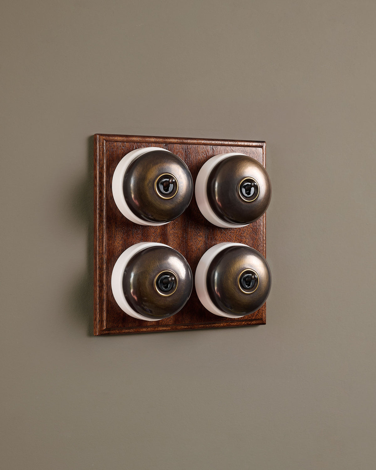 The Dolly Toggle Switch (4 Gang Bank & Mahogany Finish Pattress) - Oxidised Brass with White Base. TEST