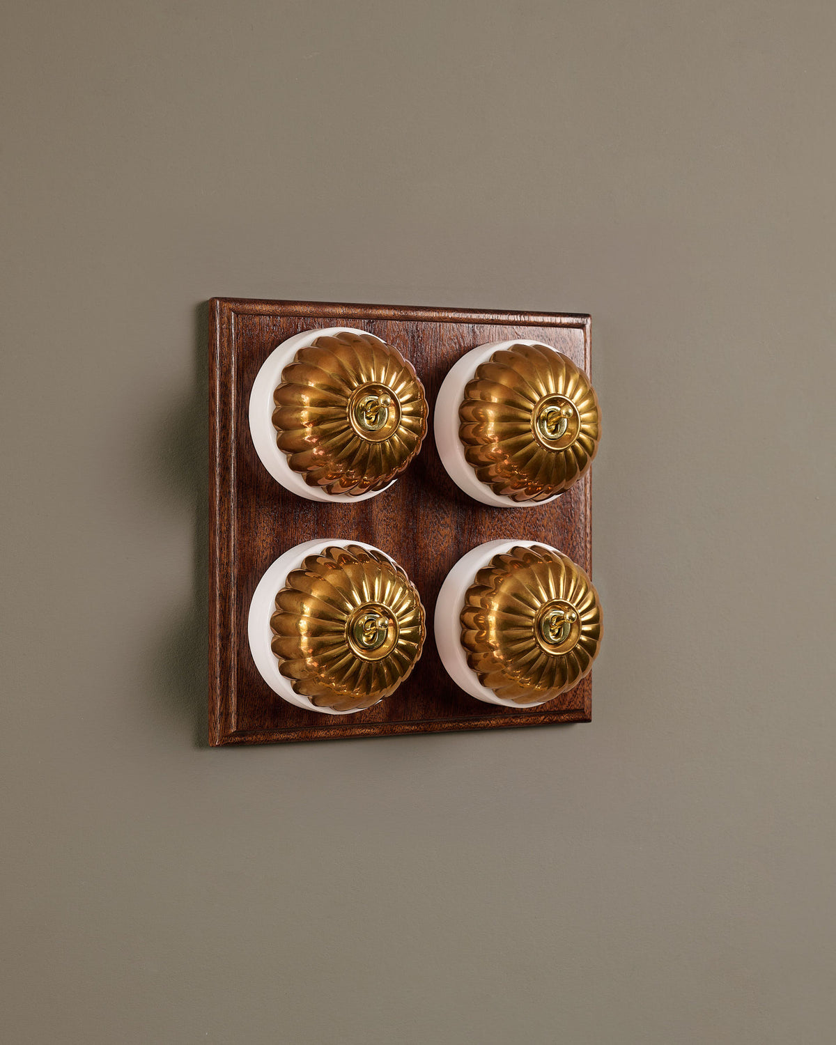 The Jelly Toggle Switch (4 Gang Bank & Mahogany Finish Pattress) - Heirloom Brass with White Base. TEST