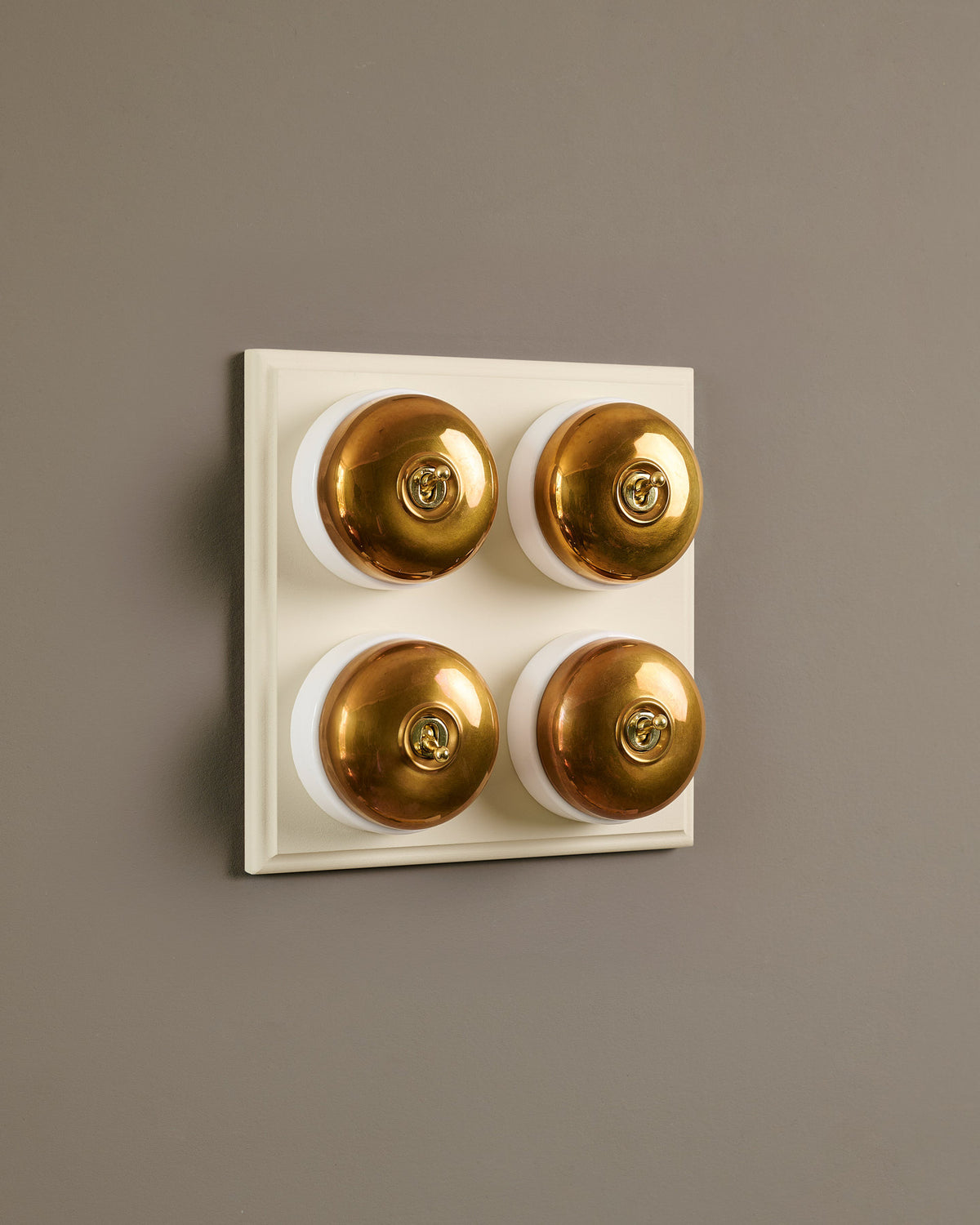 The Dolly Toggle Switch (4 Gang Bank & Primed Maple Pattress) - Heirloom Brass with White Base. TEST