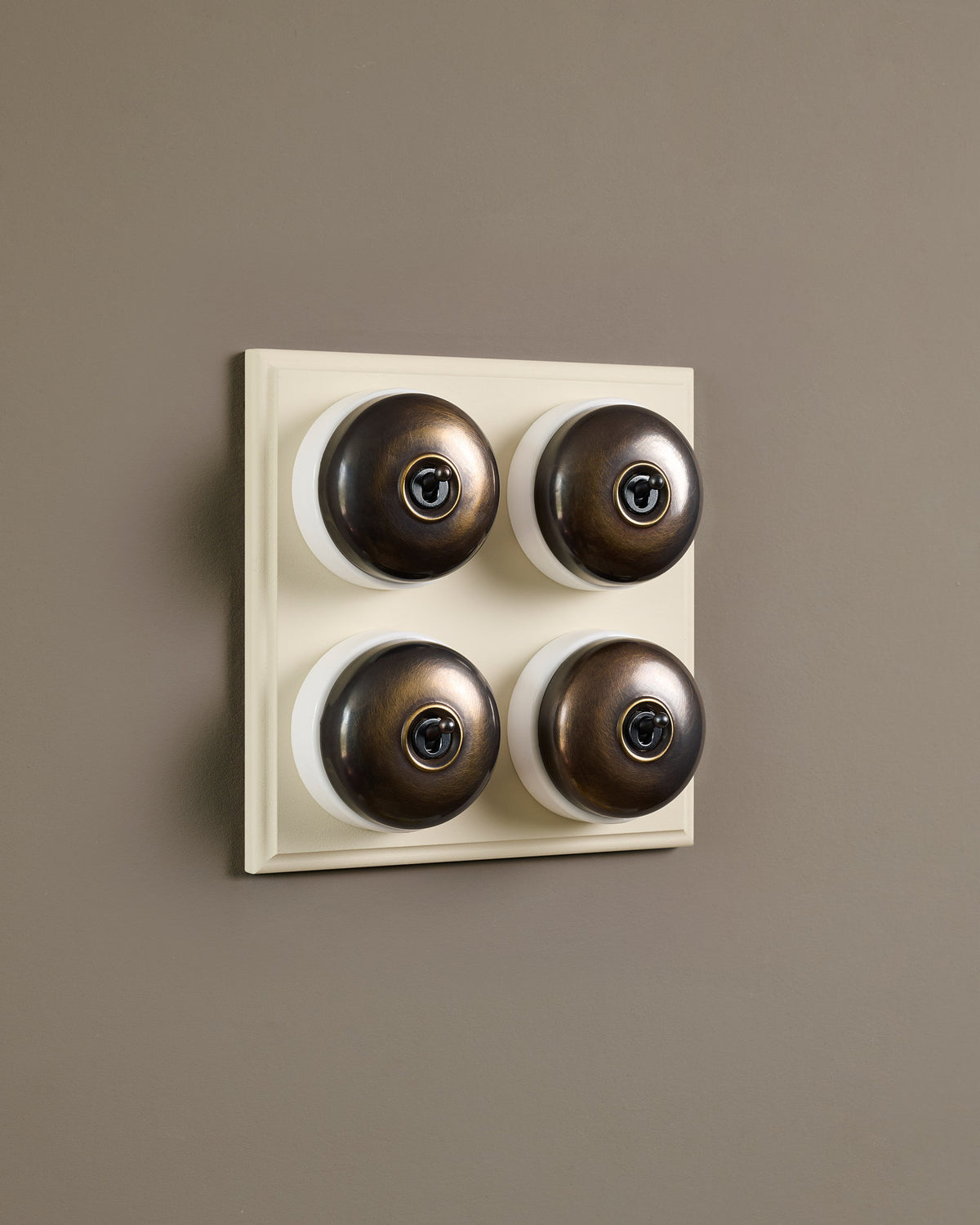 The Dolly Toggle Switch (4 Gang Bank & Primed Maple Pattress) - Oxidised Brass with White Base. TEST