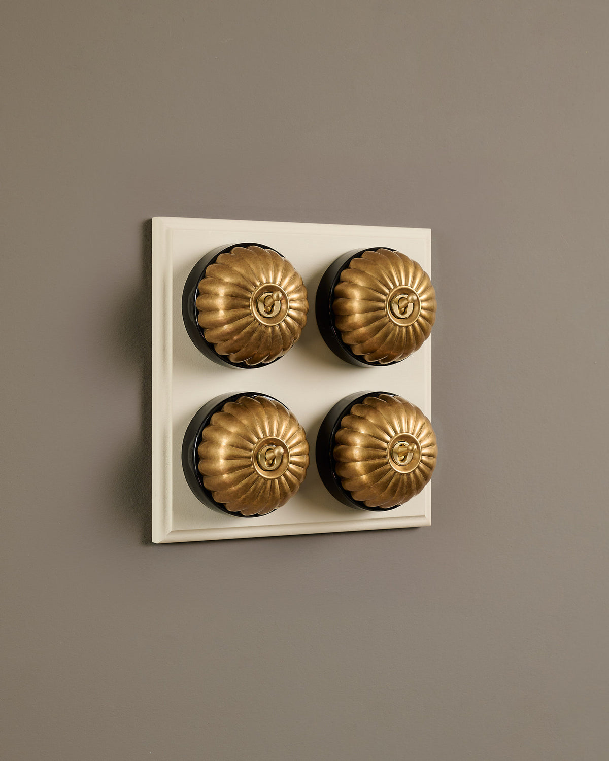 The Jelly Toggle Switch (4 Gang Bank & Primed Maple Pattress) - Aged Brass with Black Base. TEST