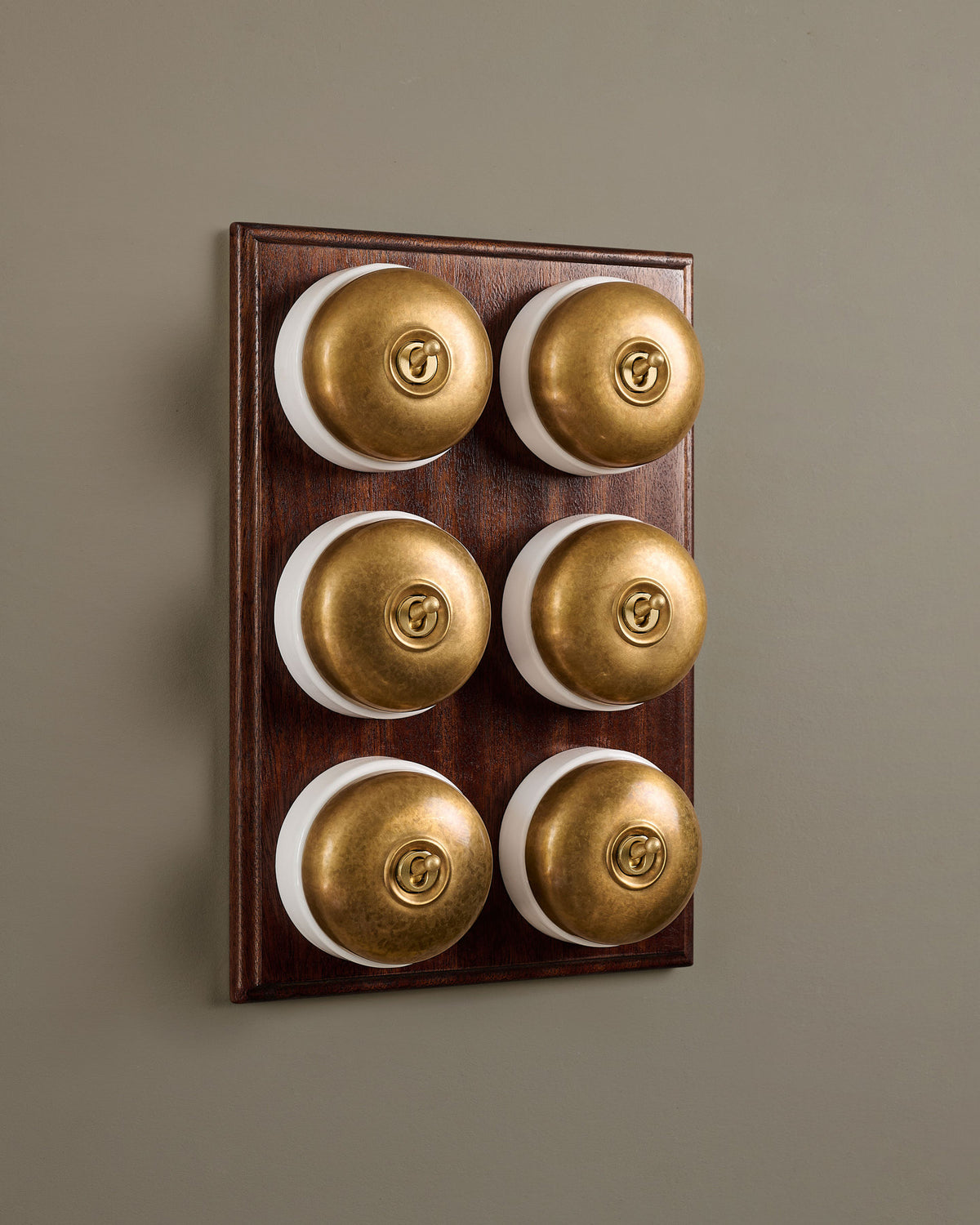 The Dolly Toggle Switch (6 Gang & Mahogany Finish Pattress) - Aged Brass with White Base. TEST