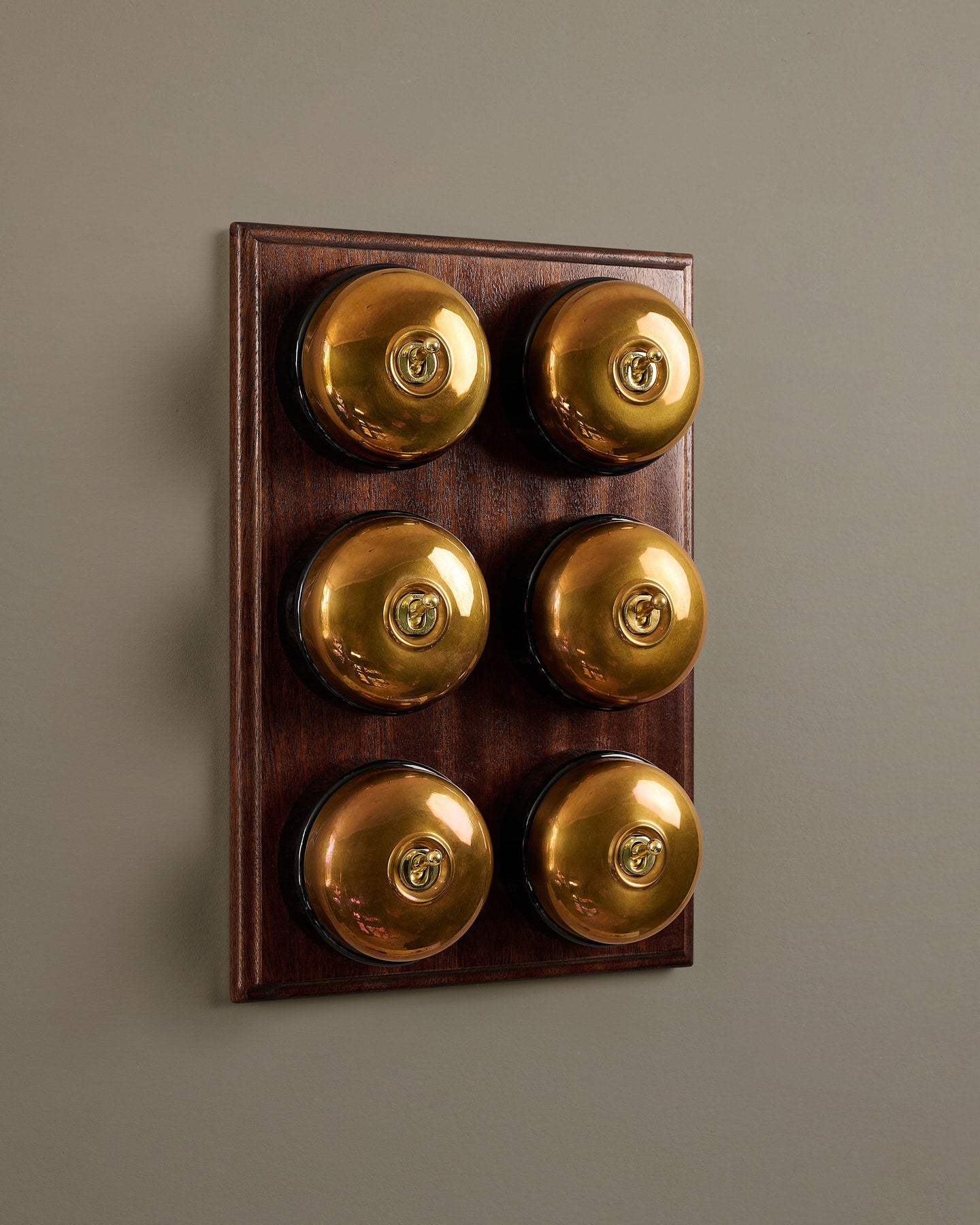 The Dolly Toggle Switch (6 Gang & Mahogany Finish Pattress) - Heirloom Brass with Black Base.