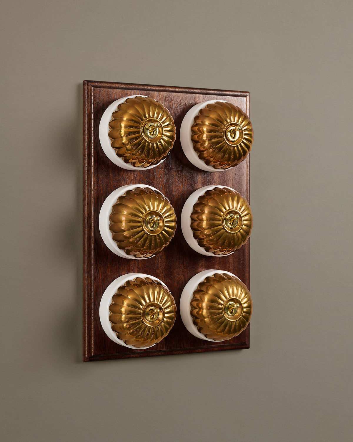 The Jelly Toggle Switch (6 Gang & Mahogany Finish Pattress) - Heirloom Brass with White Base. TEST