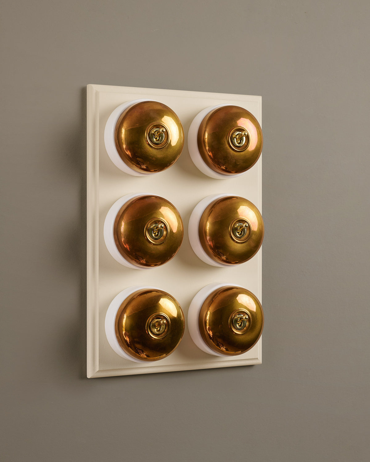 The Dolly Toggle Switch (6 Gang & Primed Maple Pattress) - Heirloom Brass with White Base. TEST