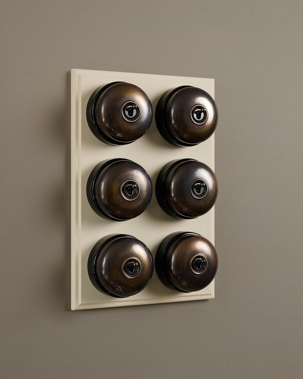 The Dolly Toggle Switch (6 Gang & Primed Maple Pattress) - Oxidised Brass with Black Base. TEST