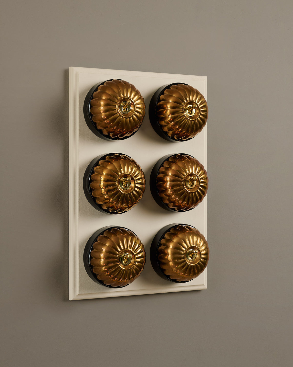 The Jelly Toggle Switch (6 Gang & Primed Maple Pattress) - Heirloom Brass with Black Base. TEST