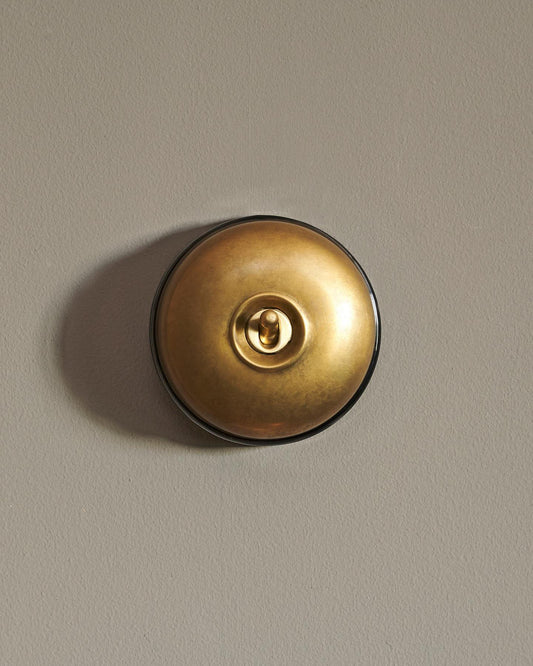 The Dolly Toggle Switch - Aged Brass, Black Base, Single Way Retract