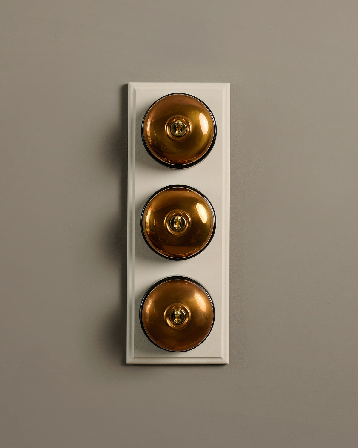 The Dolly Toggle Switch (3 Gang & Primed Maple Pattress) - Heirloom Brass with Black Base. TEST