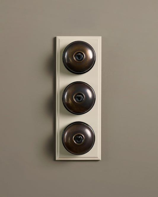 The Dolly Toggle Switch (3 Gang & Primed Maple Pattress) - Oxidised Brass with Black Base.