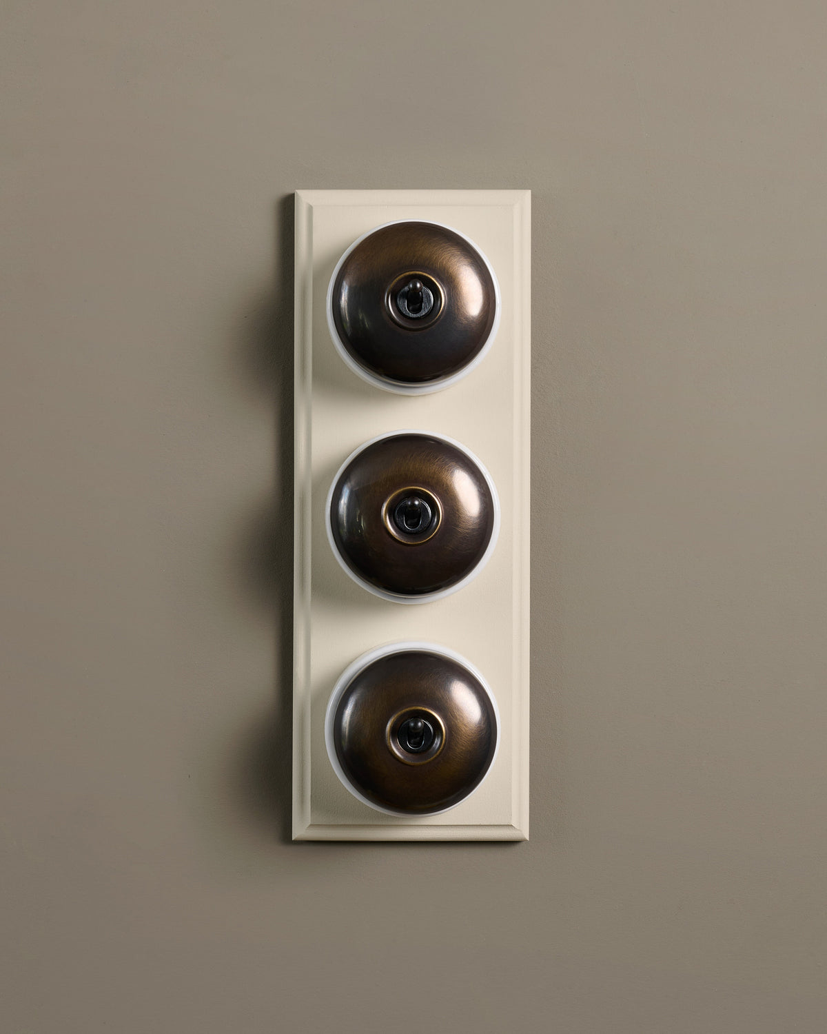 The Dolly Toggle Switch (3 Gang & Primed Maple Pattress) - Oxidised Brass with White Base. TEST