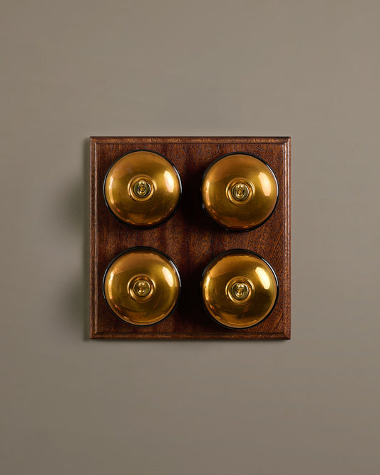 The Dolly Toggle Switch (4 Gang Bank & Mahogany Finish Pattress) - Heirloom Brass with Black Base.
