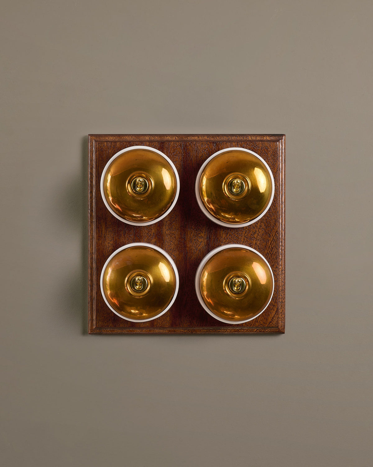 The Dolly Toggle Switch (4 Gang Bank & Mahogany Finish Pattress) - Heirloom Brass with White Base. TEST