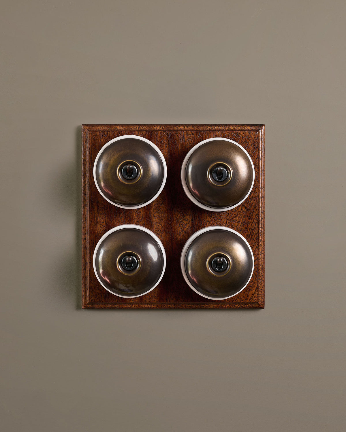 The Dolly Toggle Switch (4 Gang Bank & Mahogany Finish Pattress) - Oxidised Brass with White Base. TEST