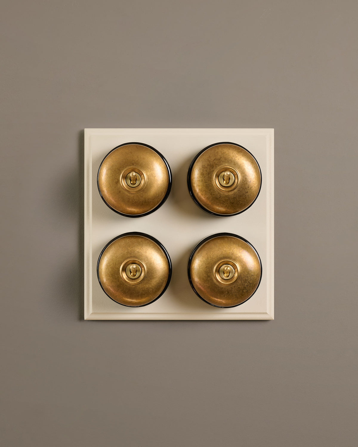 The Dolly Toggle Switch (4 Gang Bank & Primed Maple Pattress) - Aged Brass with Black Base. TEST