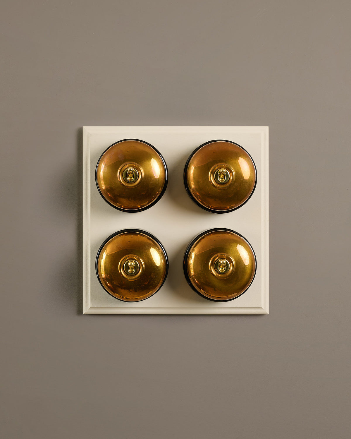The Dolly Toggle Switch (4 Gang Bank & Primed Maple Pattress) - Heirloom Brass with Black Base. TEST