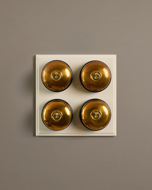 The Dolly Toggle Switch (4 Gang Bank & Primed Maple Pattress) - Heirloom Brass with Black Base.
