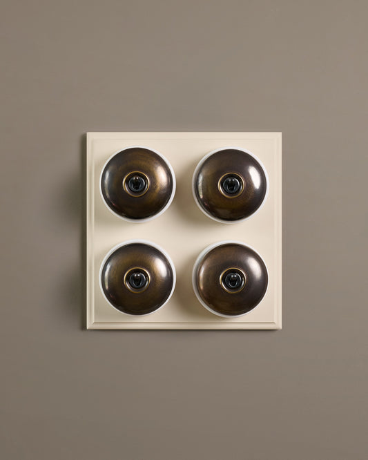 The Dolly Toggle Switch (4 Gang Bank & Primed Maple Pattress) - Oxidised Brass with White Base.