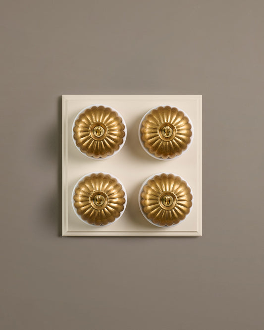 The Jelly Toggle Switch (4 Gang Bank & Primed Maple Pattress) - Aged Brass with White Base.