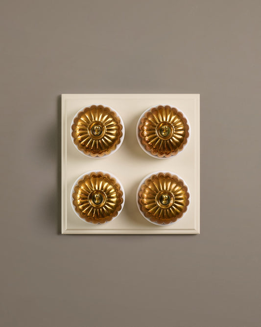 The Jelly Toggle Switch (4 Gang Bank & Primed Maple Pattress) - Heirloom Brass with White Base.