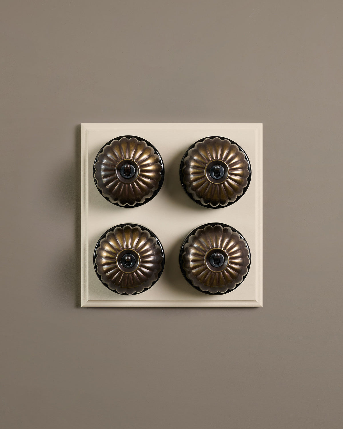 The Jelly Toggle Switch (4 Gang Bank & Primed Maple Pattress) - Oxidised Brass with Black Base. TEST