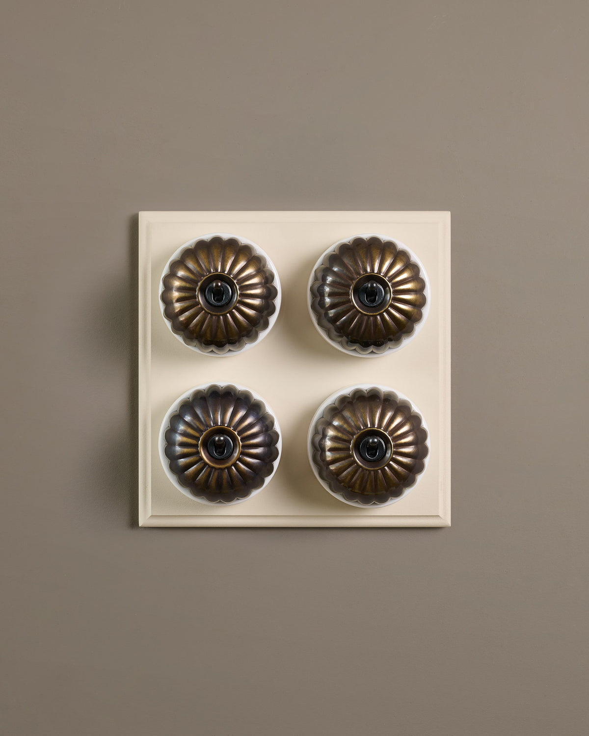The Jelly Toggle Switch (4 Gang Bank & Primed Maple Pattress) - Oxidised Brass with White Base. TEST
